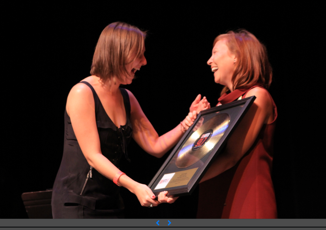 Excited Winner Receiving Gold Record Award